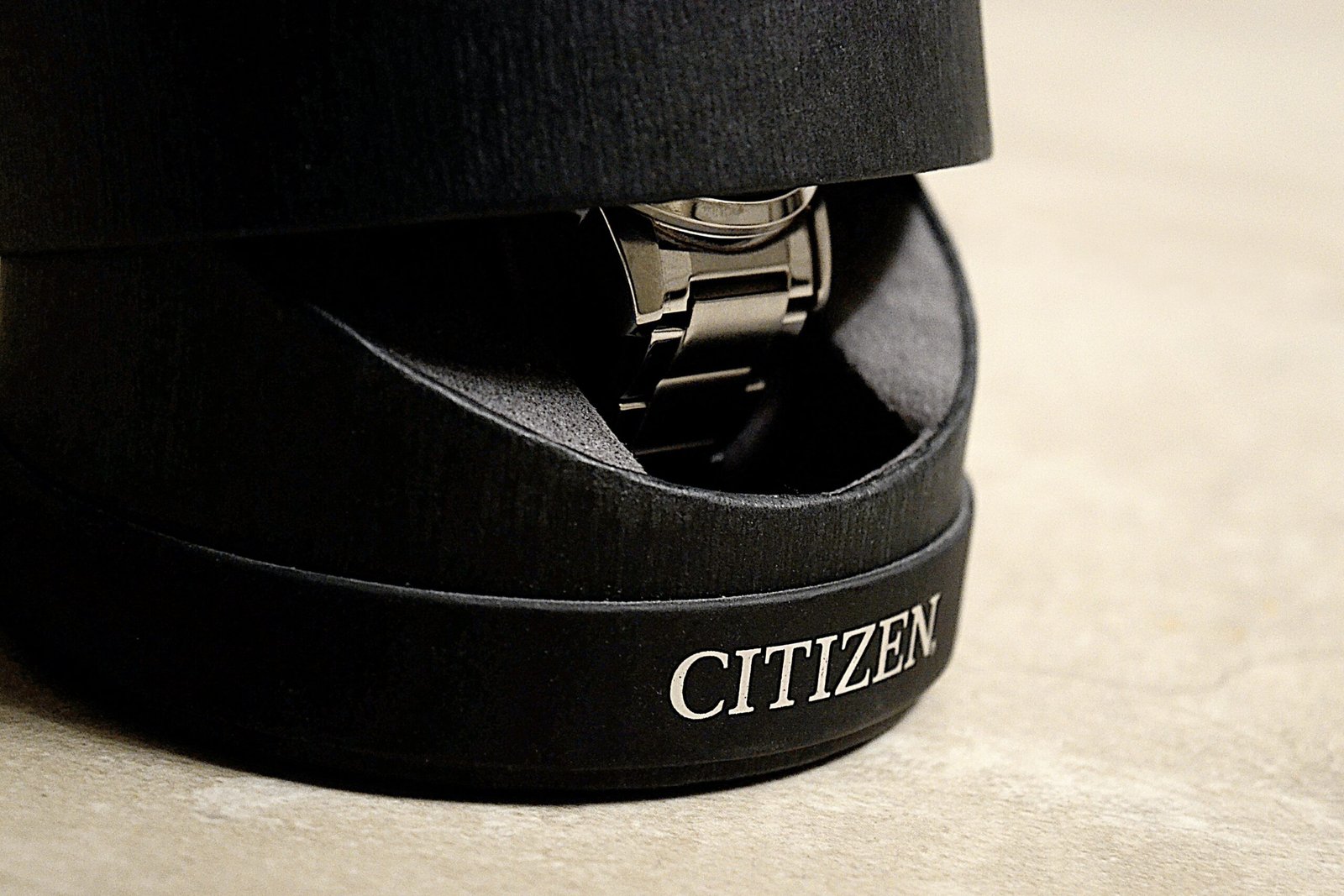 black and gold bracelet on black box